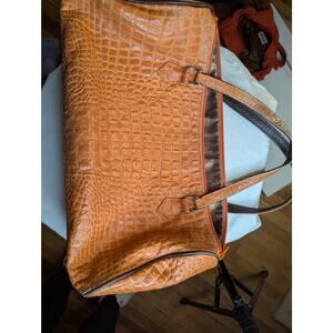 VINTAGE
      Roberto Vascon
Orange alligator leather handbag